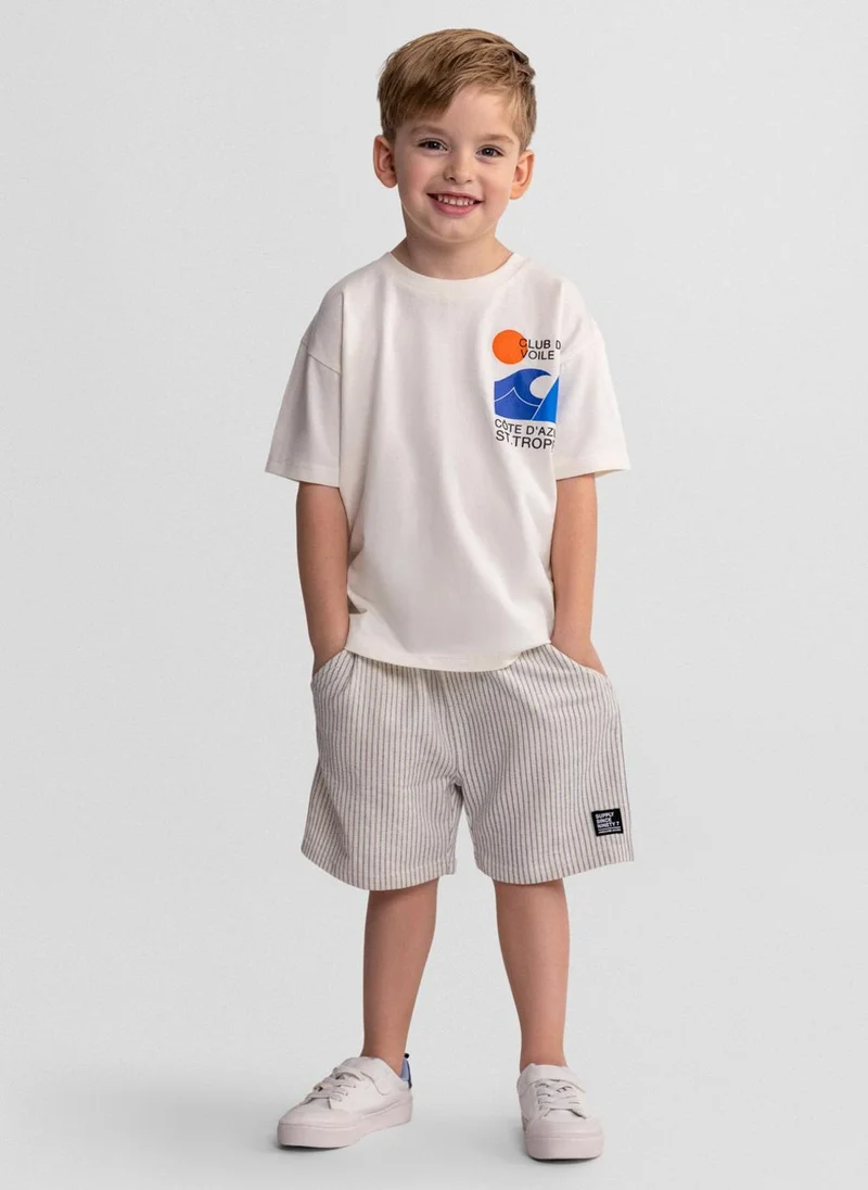 MINOTI Boys cotton short sleeve shirt offwhite and striped shorts
